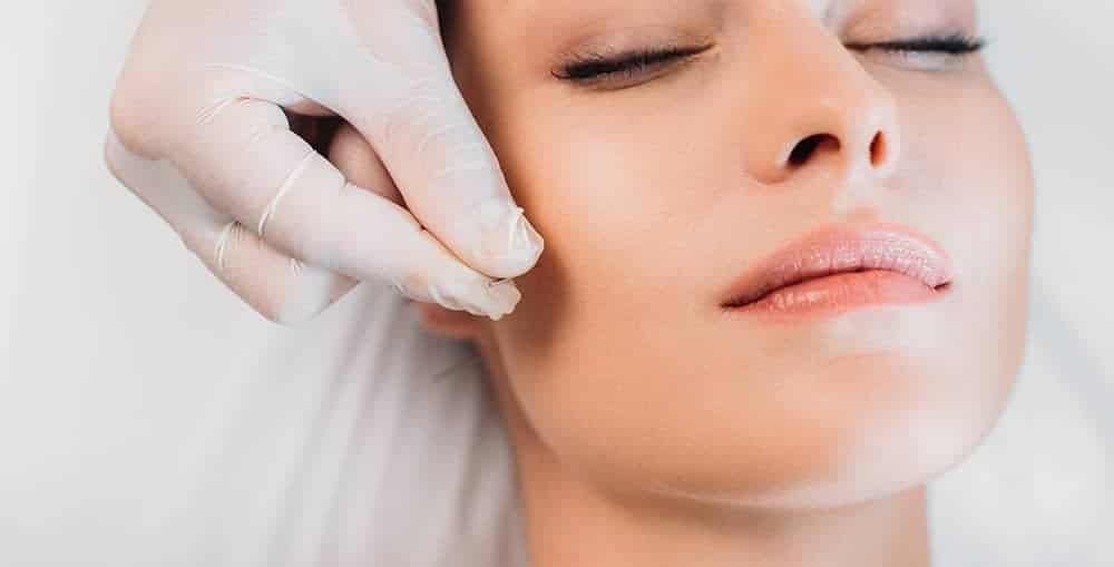 Licensed acupuncture physician performing cosmetic facial acupuncture at Health Pointe Jacksonville
