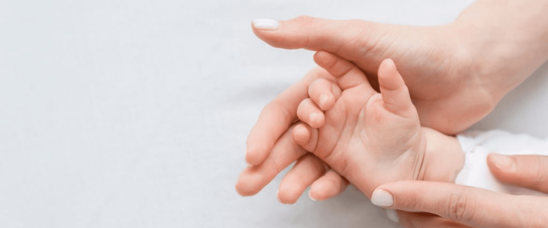 Mother holding newborn baby after successful fertility acupuncture treatment in Jacksonville FL