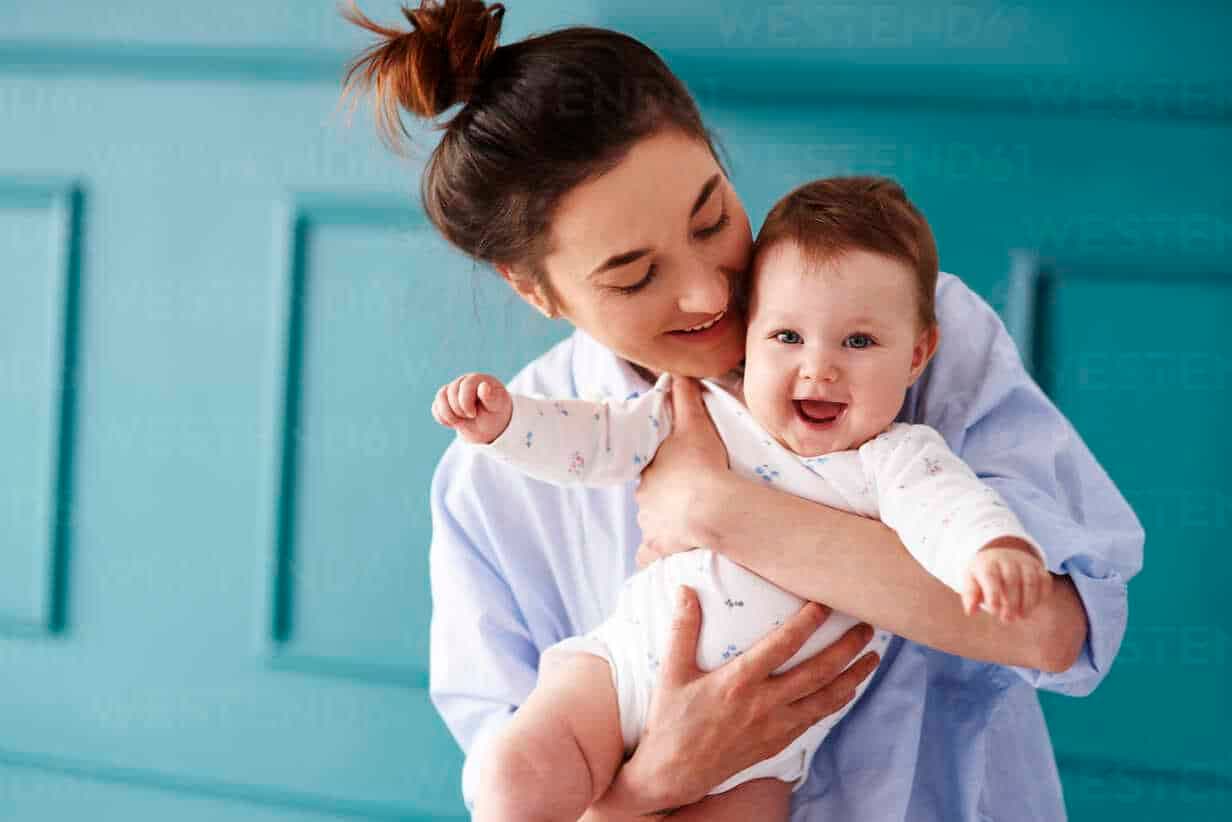 Happy mother holding her baby — fertility acupuncture at Health Pointe Jacksonville