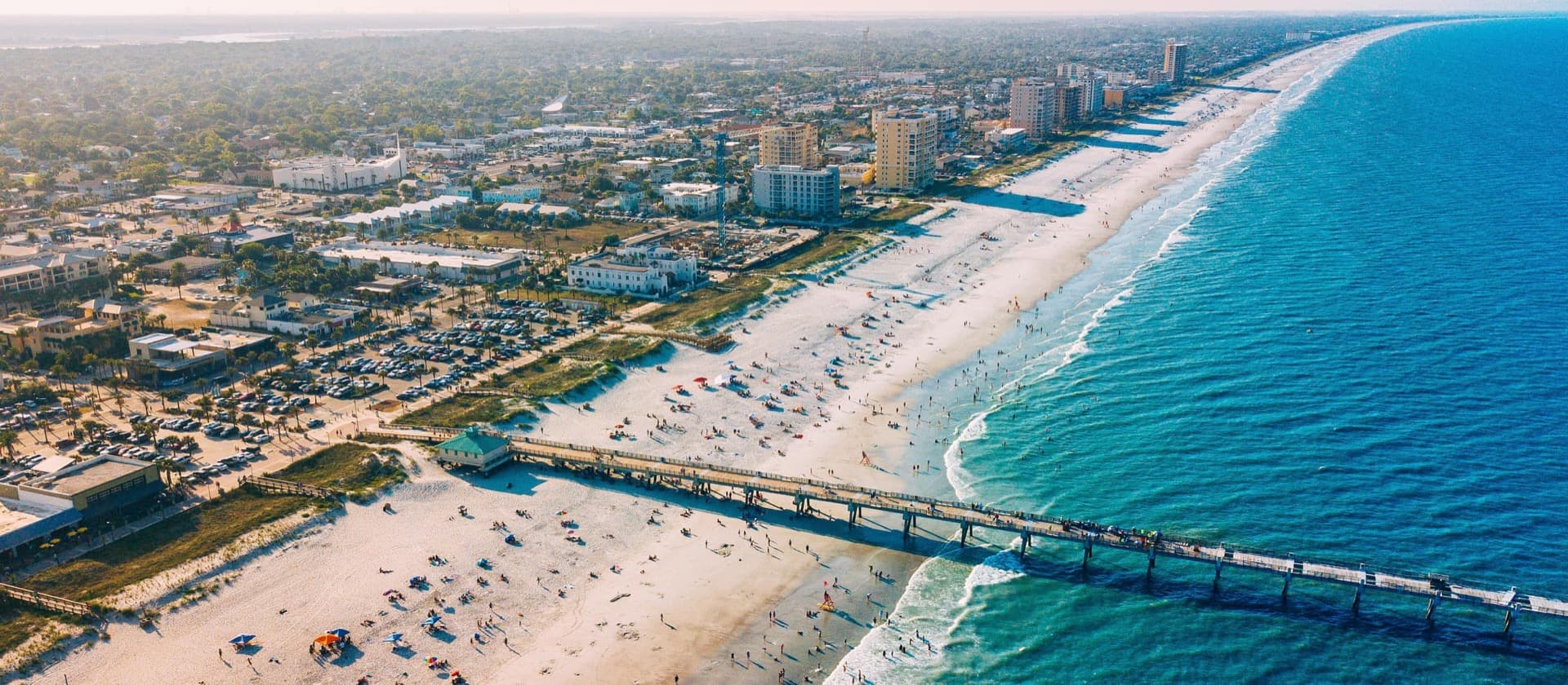 Aerial view of Jacksonville Beach, FL pier and coastline — Health Pointe Jacksonville acupuncture clinic serves Jacksonville Beach patients