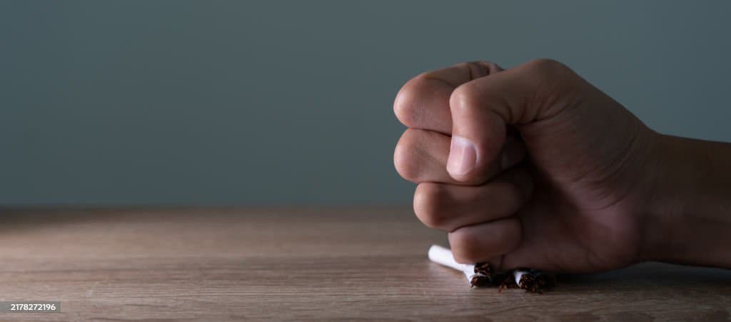 Fist crushing a cigarette — quit smoking with acupuncture at Health Pointe Jacksonville