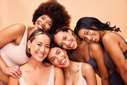 Diverse women smiling — patients at Health Pointe Jacksonville dry needling clinic